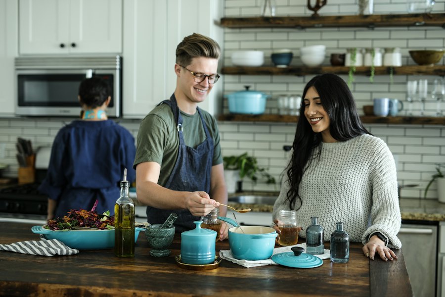 Two people preparing food in a kitchen